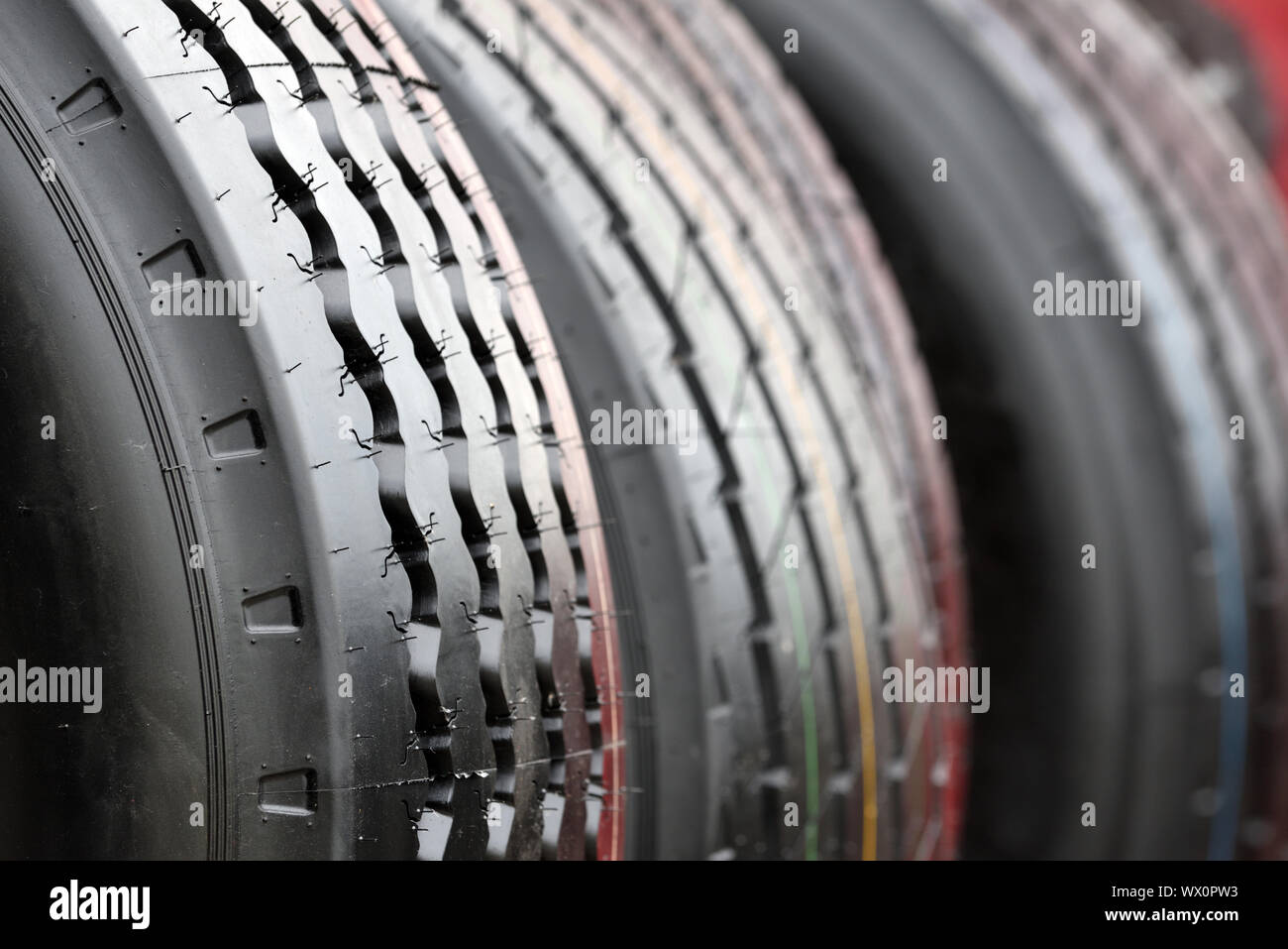 Big truck wheel a black tires closeup Stock Photo