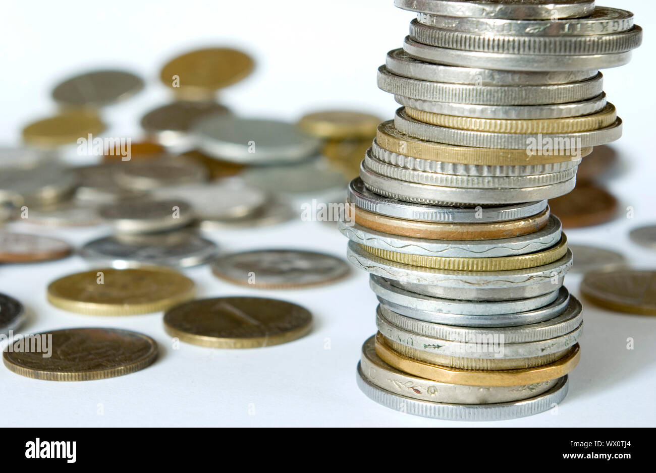 Coin pile isolated on white background Stock Photo - Alamy