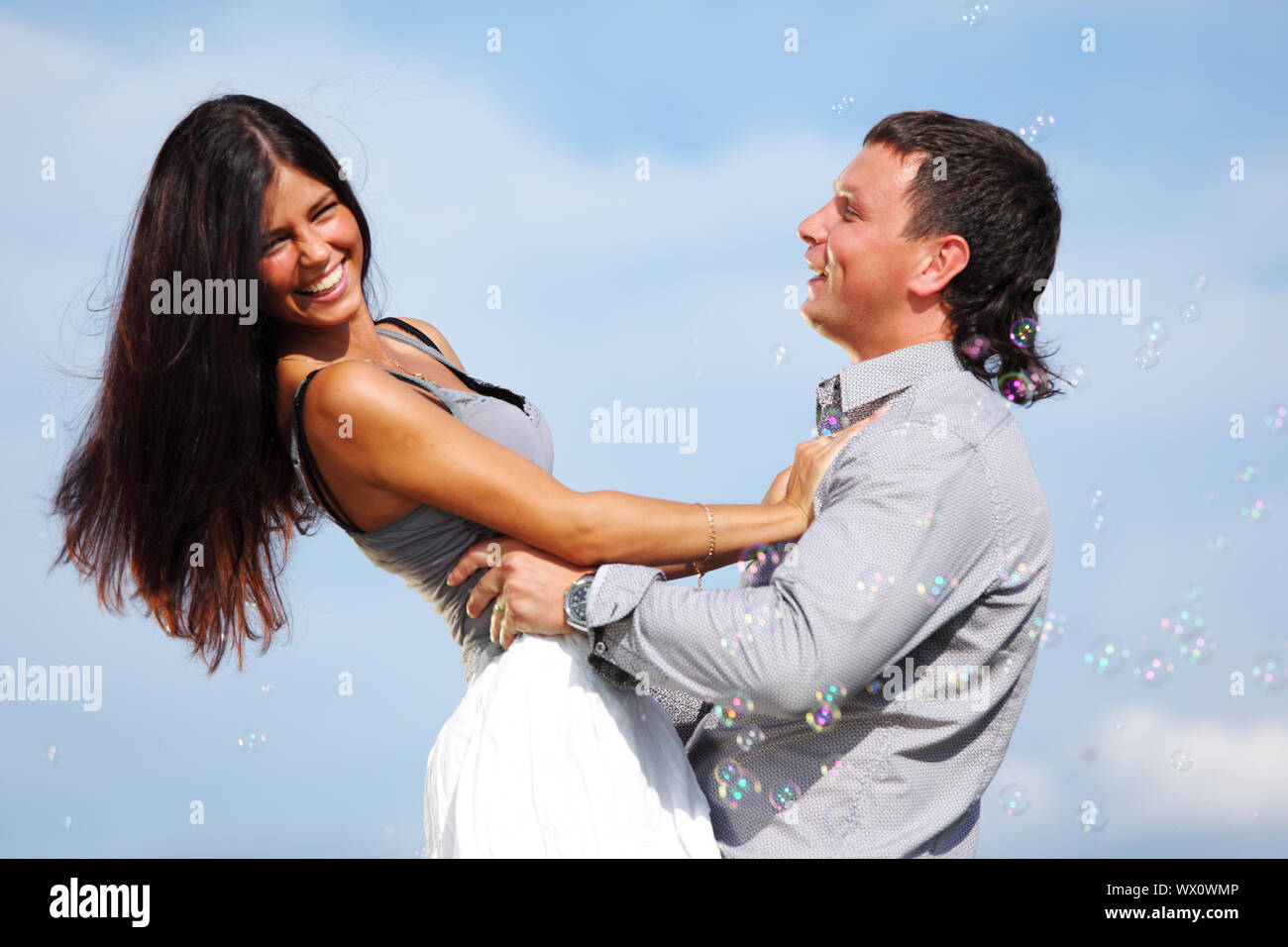 man and woman hug in the sky Stock Photo - Alamy