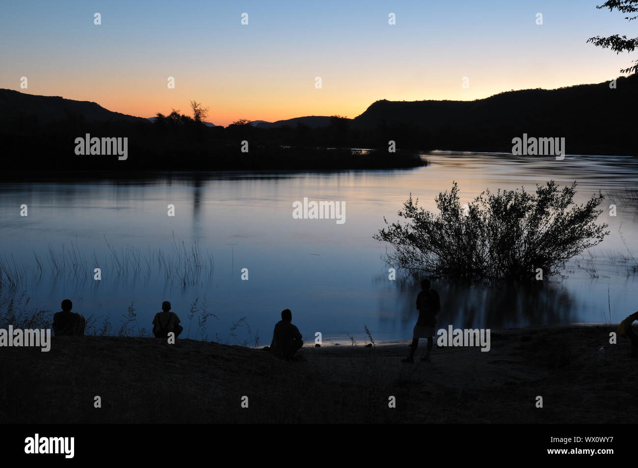 Sunset at Hippo Pools in the Kunene River on the border of Namibia and Angola Stock Photo