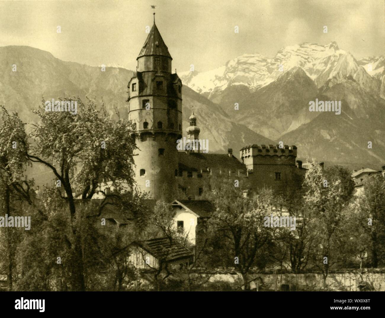 Mint Tower, Hall, Austria, c1935. The medieval Mint Tower (M&#xfc;nzturm) in the town of Hall, is a dodecagonal building with a copper roof. The tower is part of the Burg Hasegg, which for 300 years was the mint for silver Thaler coins, the root of the modern word 'dollar'. From &quot;&#xd6;sterreich - Land Und Volk&quot;, (Austria, Land and People). [R. Lechner (Wilhelm M&#xfc;ller), Vienna, c1935] Stock Photo