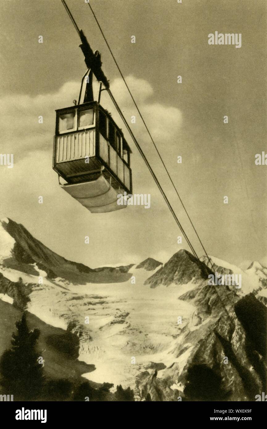 Patscherkofelbahn, Innsbruck, Tyrol, Austria, c1935. The Patscherkofel cable car takes people from the village of Igls up onto the Patscherkofel mountain to the south of Innsbruck. From &quot;&#xd6;sterreich - Land Und Volk&quot;, (Austria, Land and People). [R. Lechner (Wilhelm M&#xfc;ller), Vienna, c1935] Stock Photo