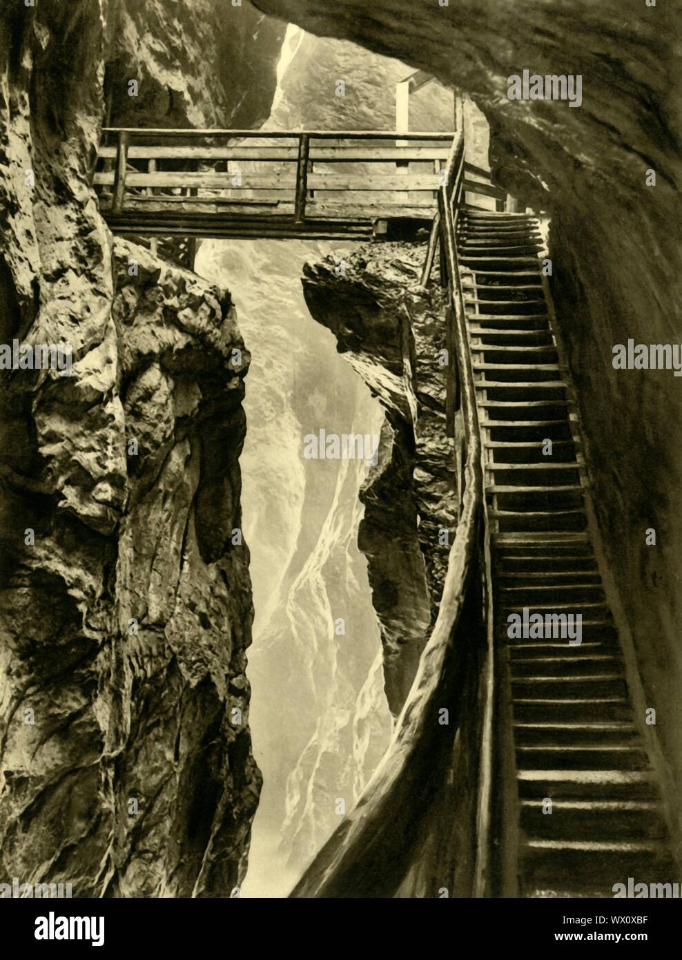 The Liechtenstein Gorge, Austria, c1935. The Liechtensteinklamm is a narrow gorge with walls up to 300 metres high, in the Austrian Alps near Salzburg. Prince Johann II of Liechtenstein had the wooden walkways installed in 1875. From &quot;&#xd6;sterreich - Land Und Volk&quot;, (Austria, Land and People). [R. Lechner (Wilhelm M&#xfc;ller), Vienna, c1935] Stock Photo