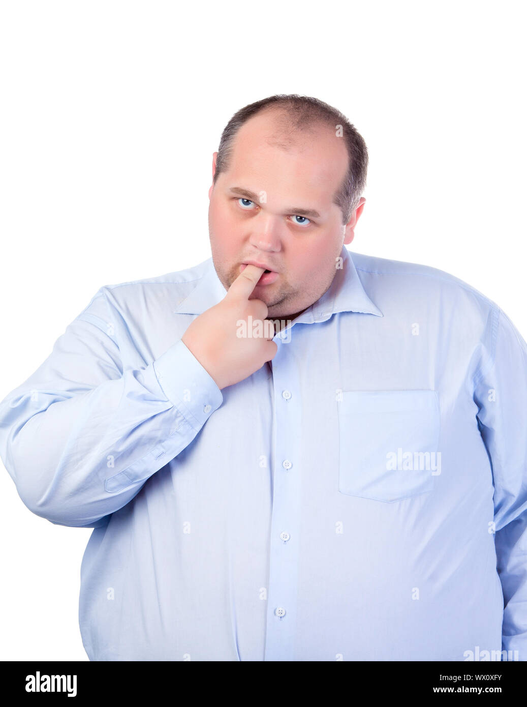 Fat Man in a Blue Shirt, Thumb-Sucking, isolated Stock Photo