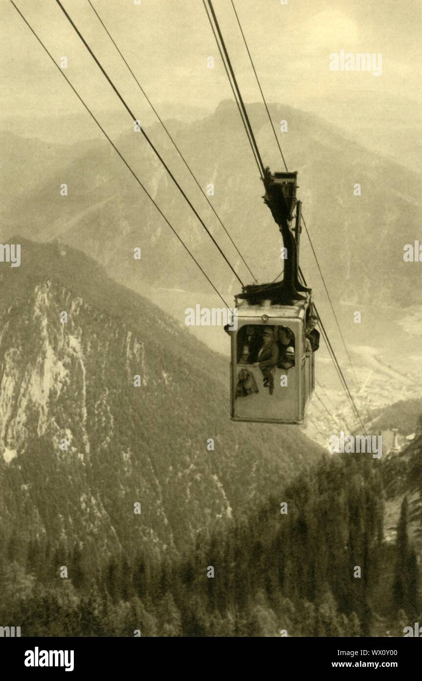 The Feuerkogel cable car, Upper Austria, c1935. The Feuerkogelbahn is an aerial tramway, built in 1927, which runs from the town of Ebensee up to the summit of the Feuerkogel mountain. The cable car featured in the film &quot;Where Eagles Dare&quot;, (1968). From &quot;&#xd6;sterreich - Land Und Volk&quot;, (Austria, Land and People). [R. Lechner (Wilhelm M&#xfc;ller), Vienna, c1935] Stock Photo