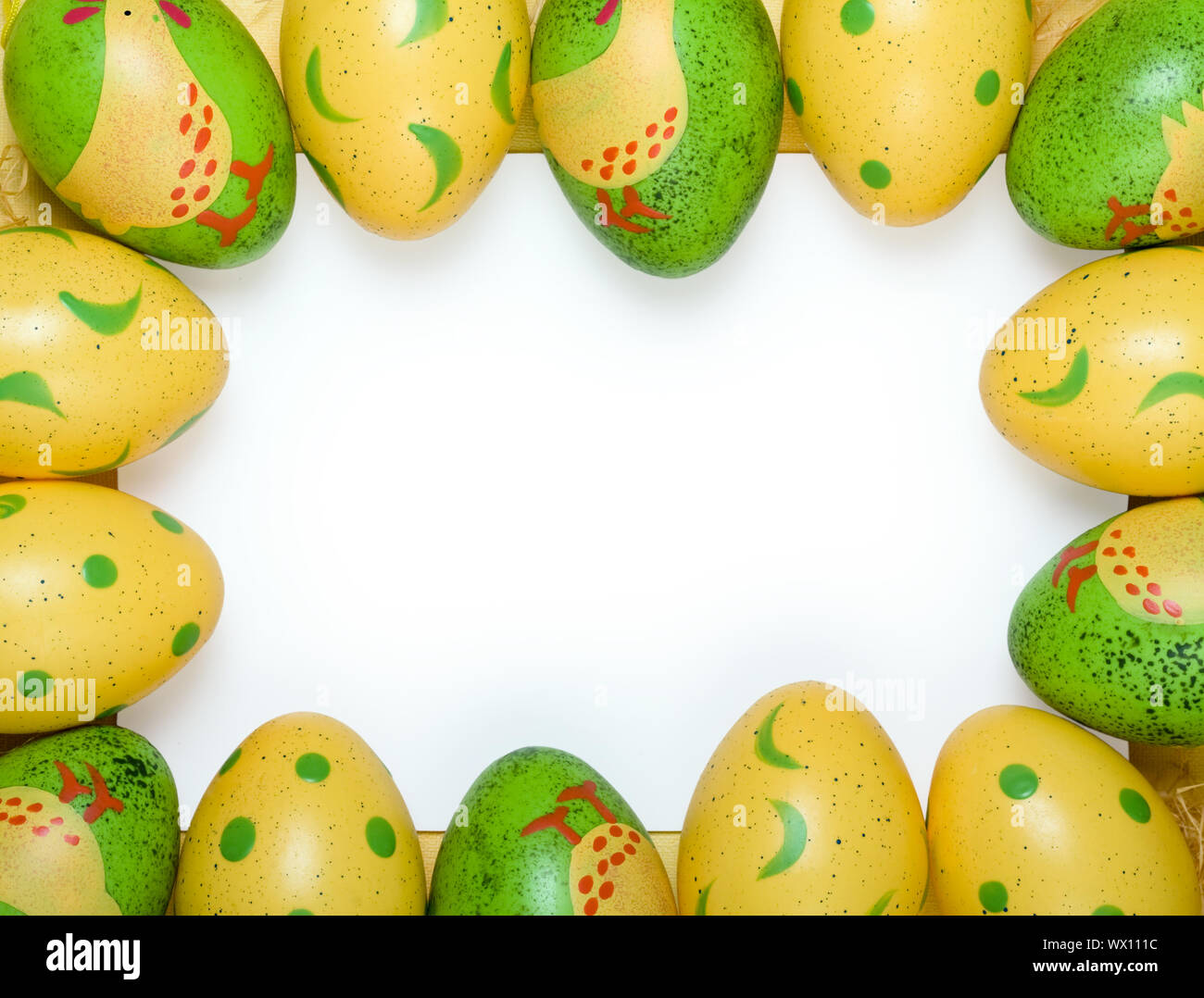 Blank card framed by colorful Easter eggs Stock Photo