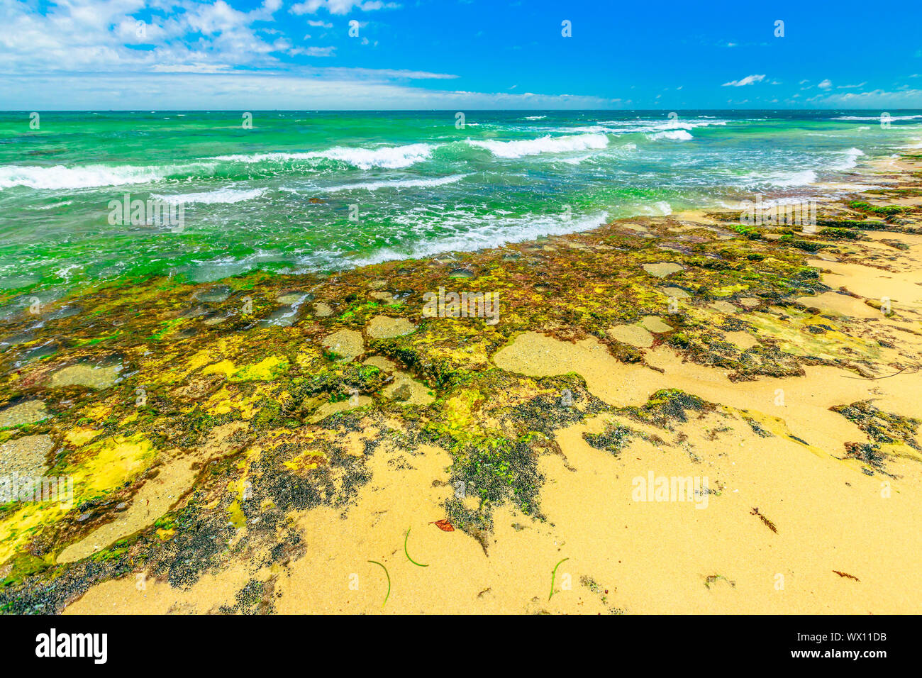 Mettams Pool with low tide, a limestone bay safe for snorkelling place. Trigg Beach in North Beach near Perth, WA. Mettam's is a natural rock pool Stock Photo