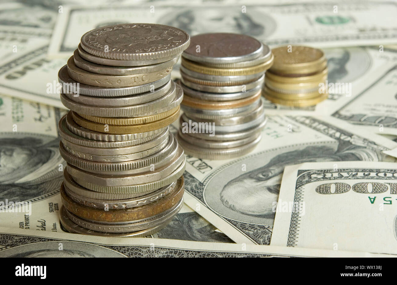 coins isolated on dollars background Stock Photo - Alamy