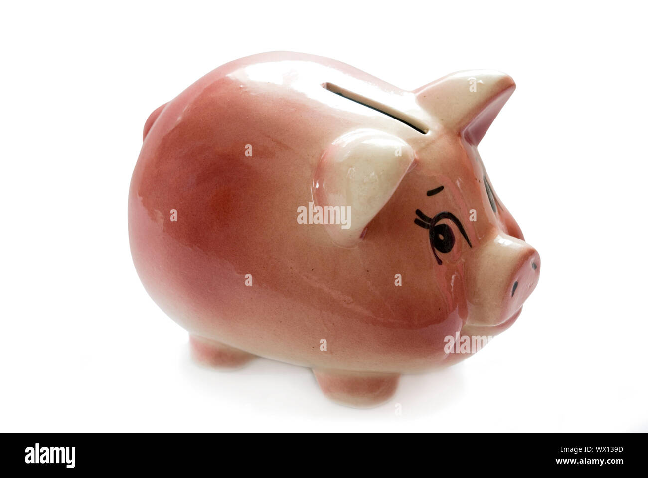 Pink piggy bank isolated on white background with coins Stock Photo - Alamy