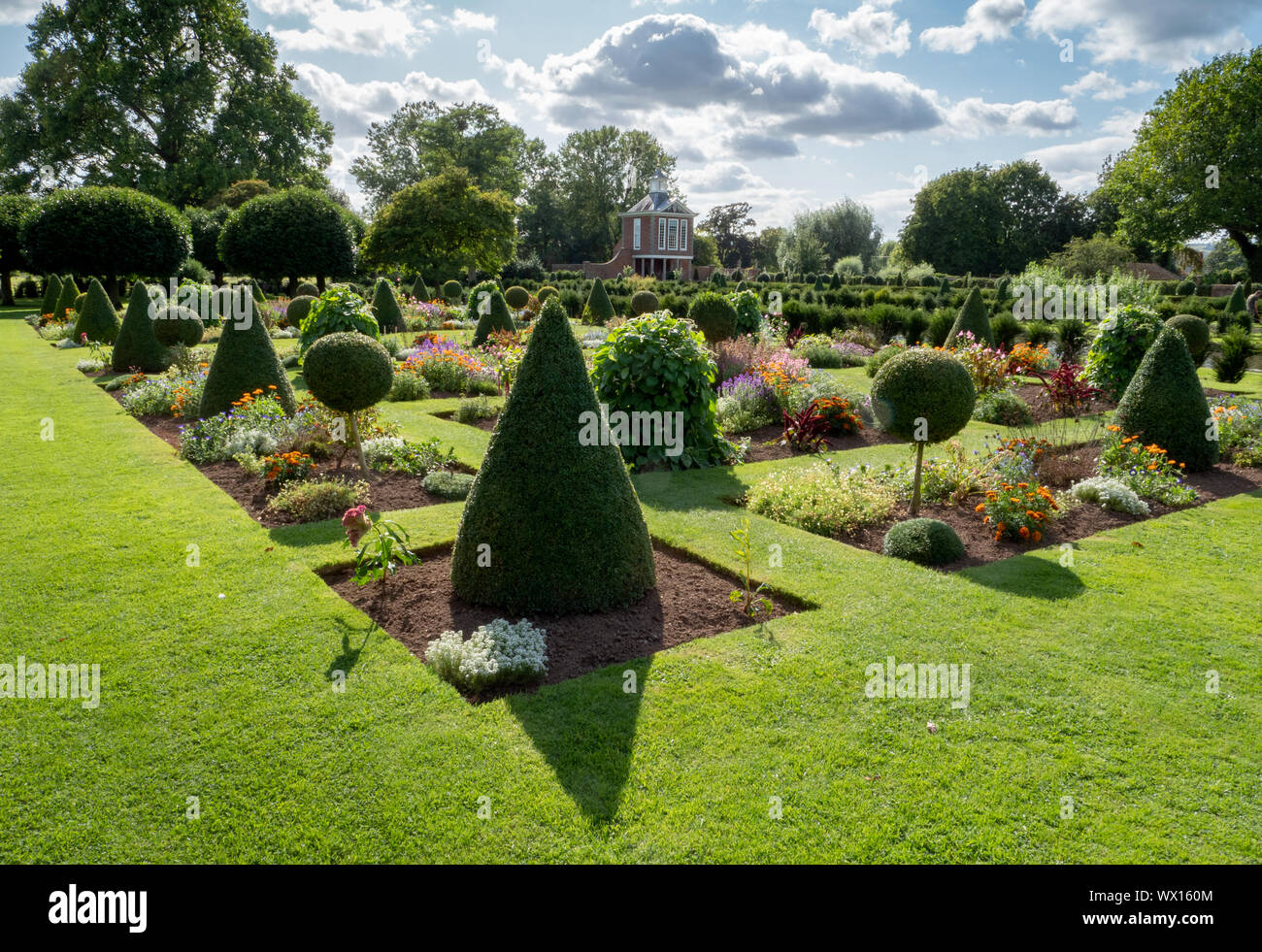 Topiary and flower parterre at Wesbury Court Garden a 17th century Dutch style water garden at Westbury on Severn Gloucestershire UK Stock Photo