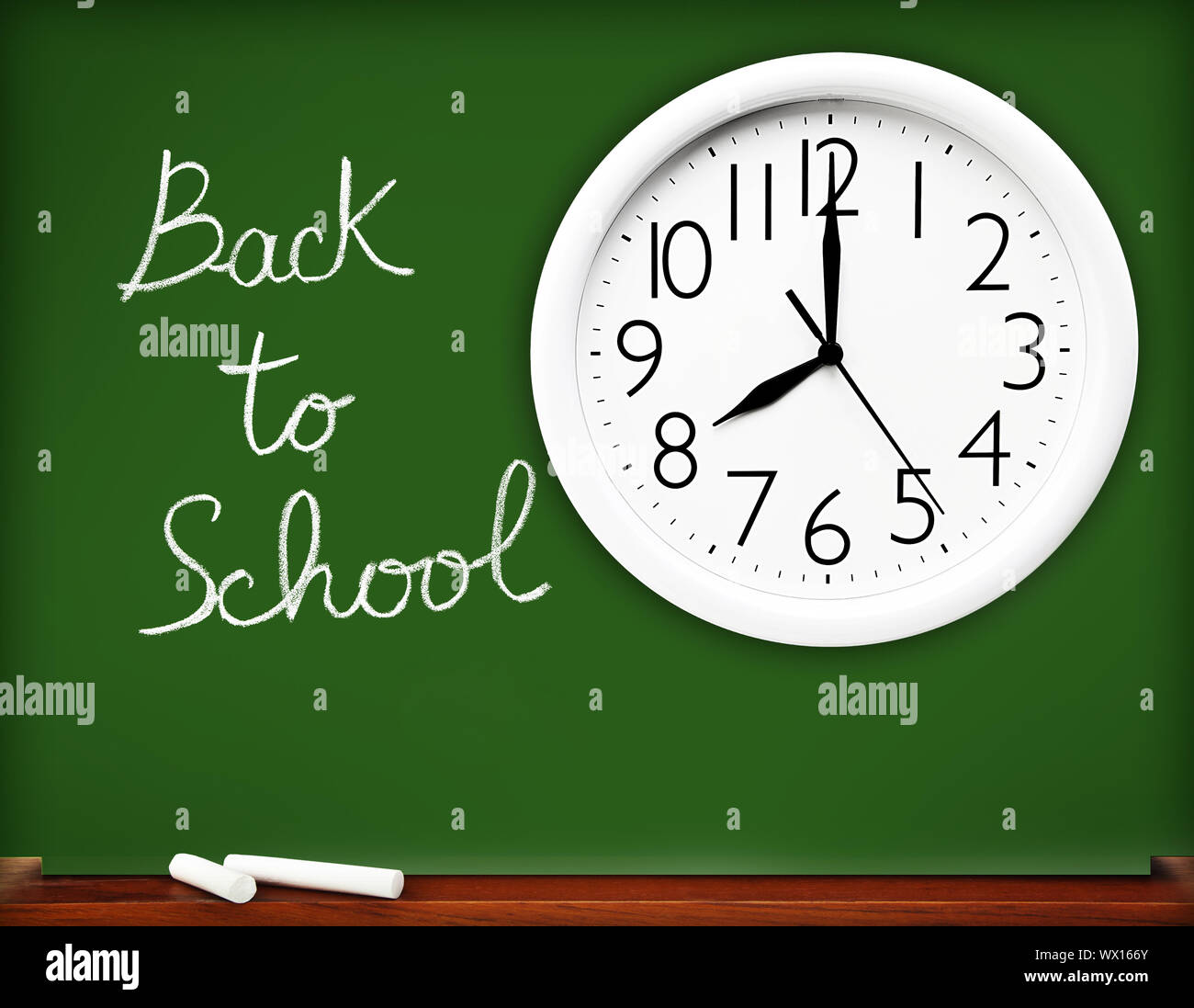 Back to school concept, handwriting on a green chalkboard with big ...