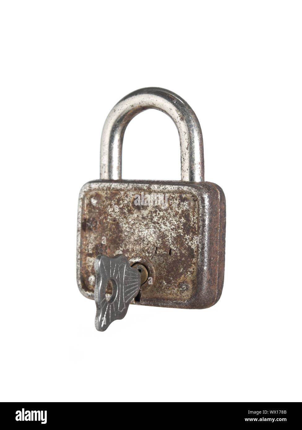 A closed lock with a key isolated on white background Stock Photo - Alamy