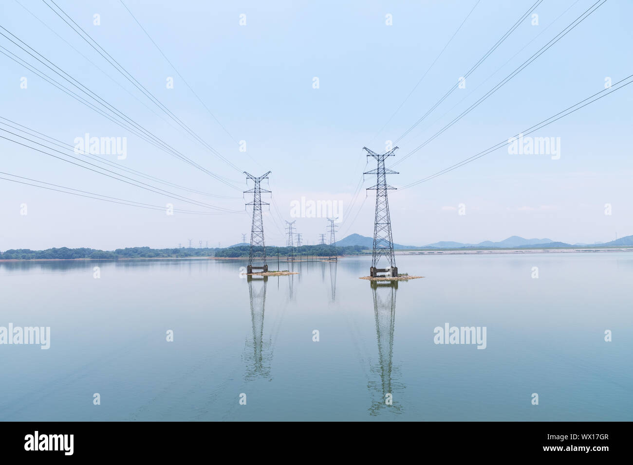 power transmission tower on water Stock Photo