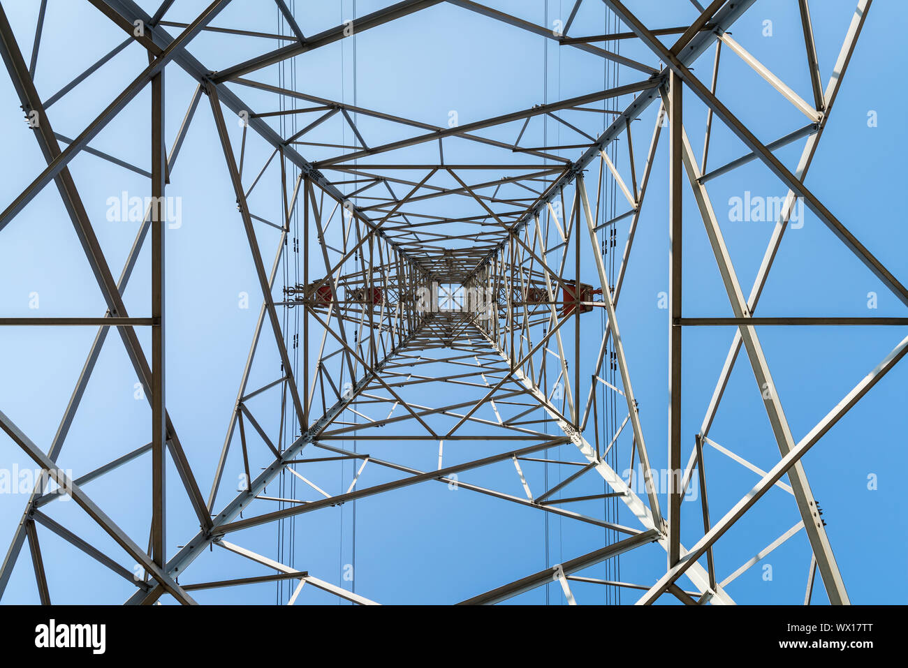 electricity pylon with blue sky Stock Photo - Alamy