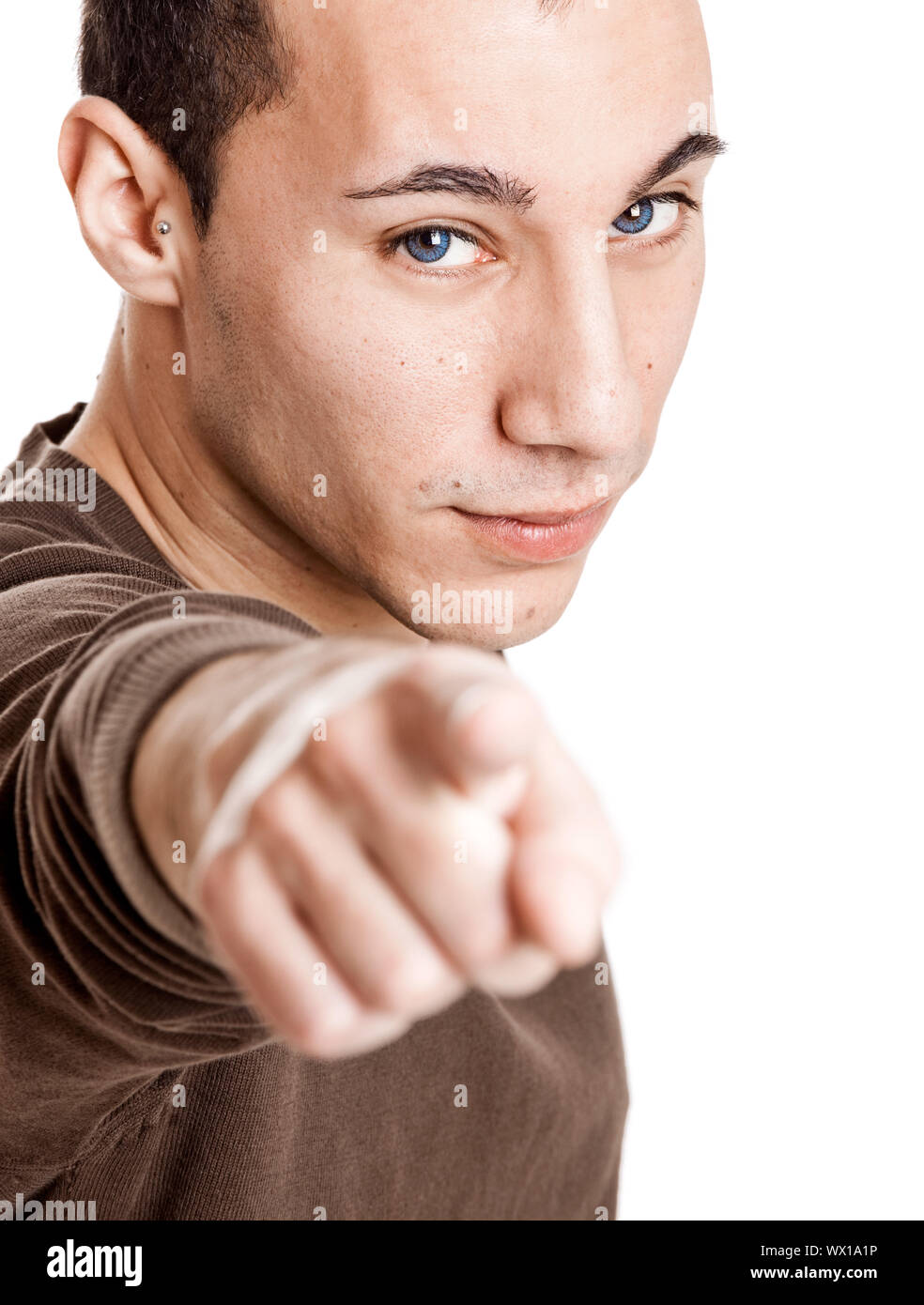 Portrait of a smart guy pointing to something, isolated on white Stock