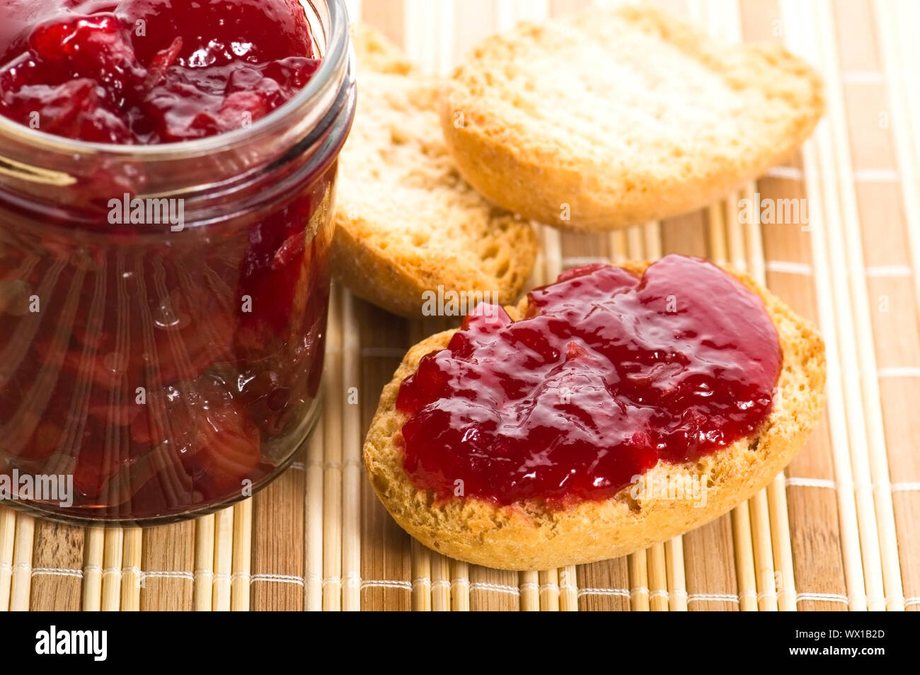 Breakfast of cherry jam on toast Stock Photo Alamy