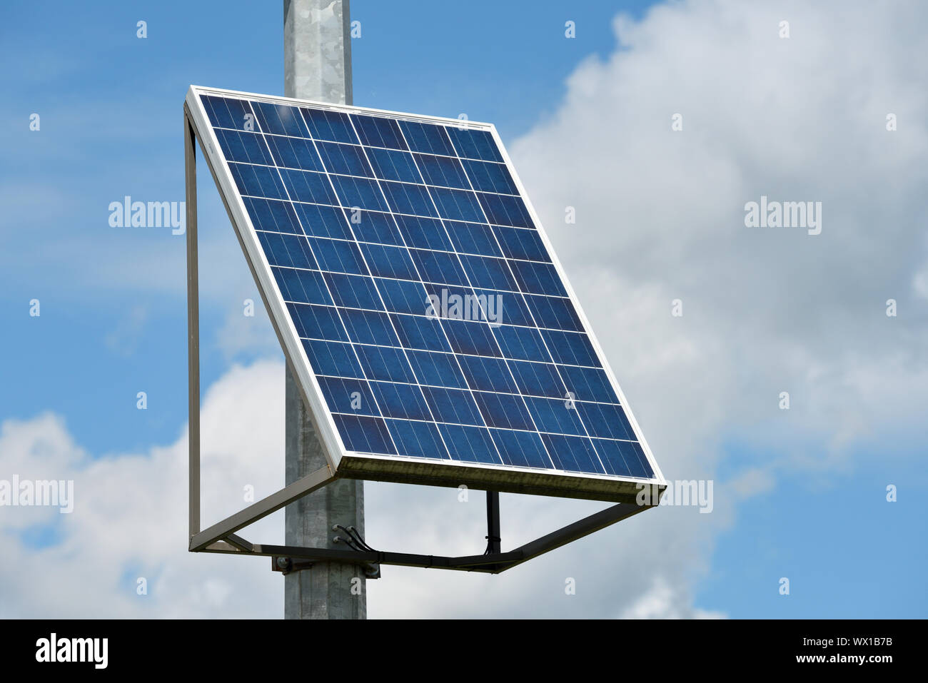 Solar panel or Solar cell with blue sky and clouds Stock Photo