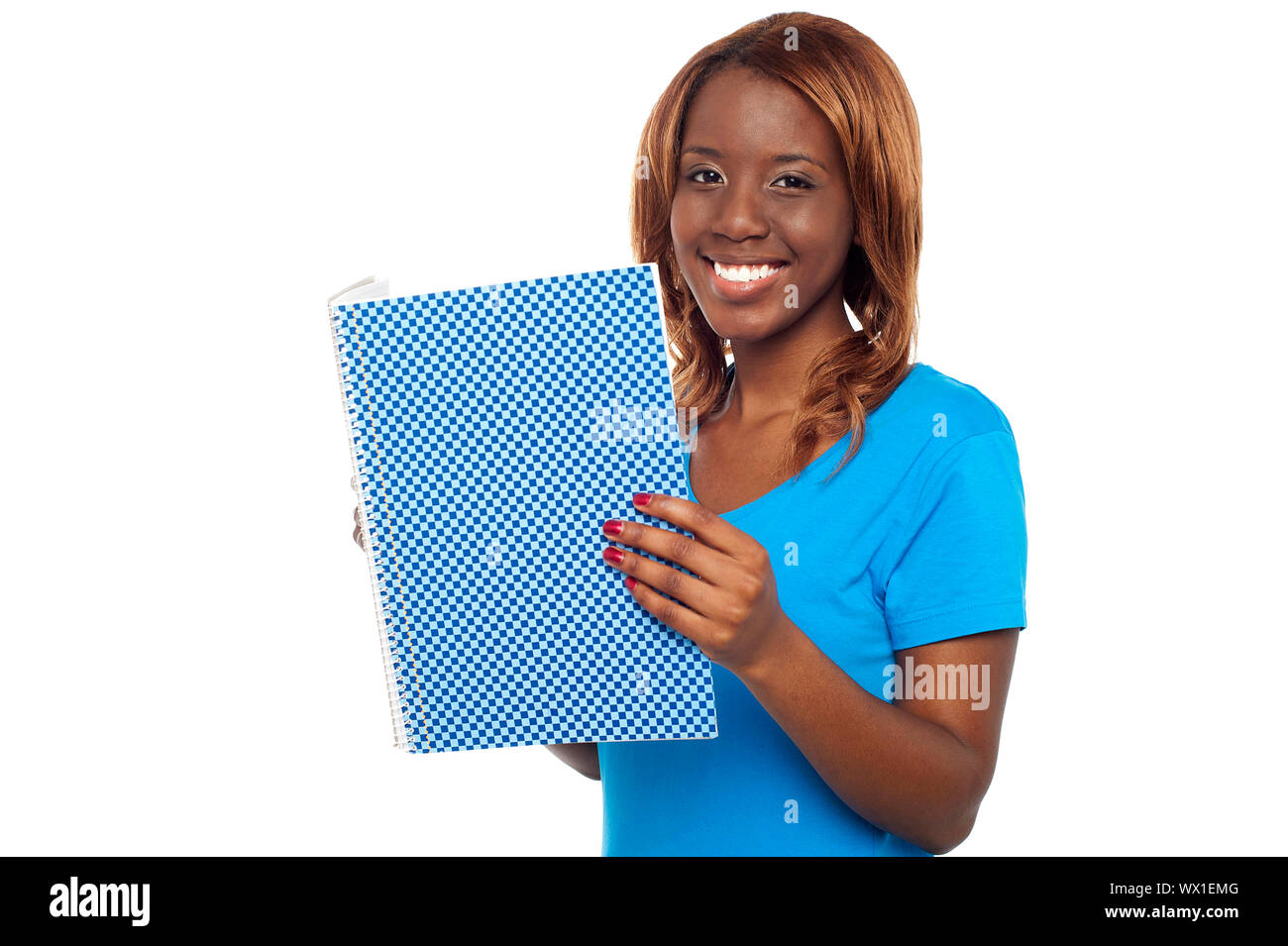 Smiling college student holding notebook and looking at camera Stock ...