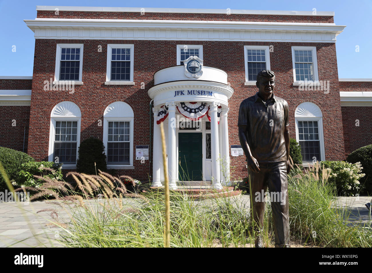 The bronze statue of former President John F. Kennedy in front of John F. Kennedy Hyannis Museum aka JFK Museum.Hyannis.Cape Cod.Massachusetts.USA Stock Photo