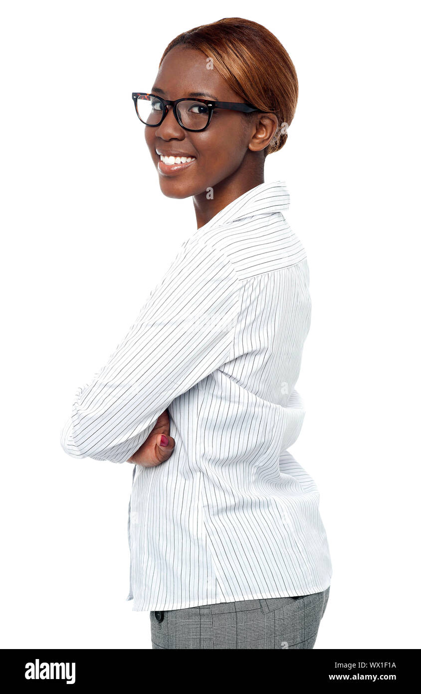 Isolated african business executive smiling with crossed arms. Side view Stock Photo