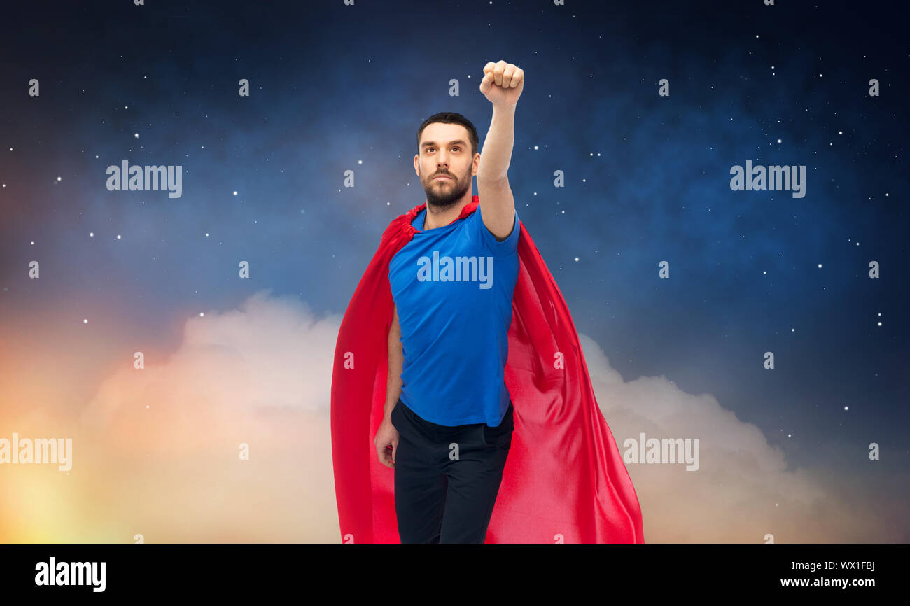 man in red superhero cape over night sky Stock Photo - Alamy