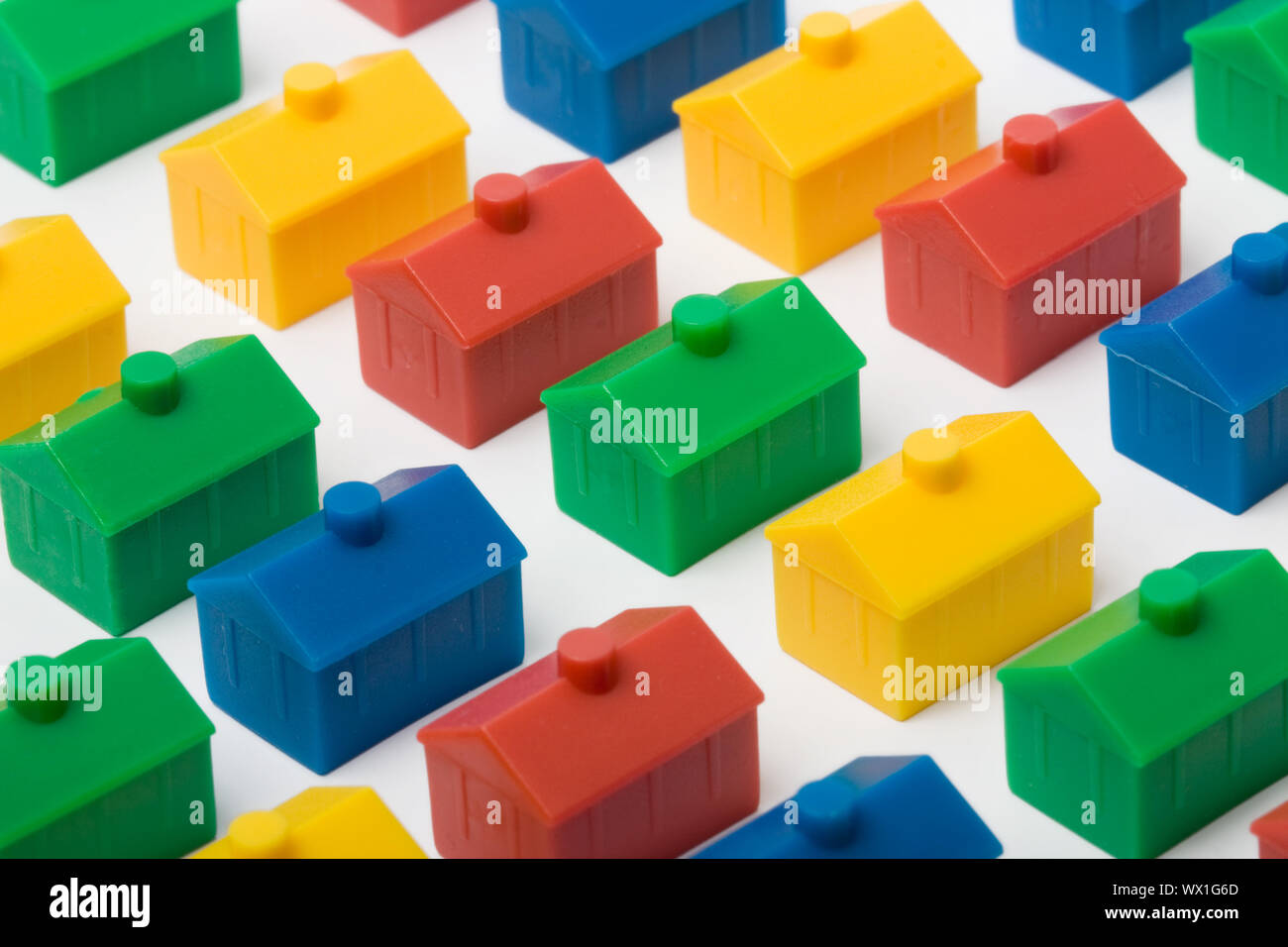 Colorful model houses set against a white background Stock Photo - Alamy