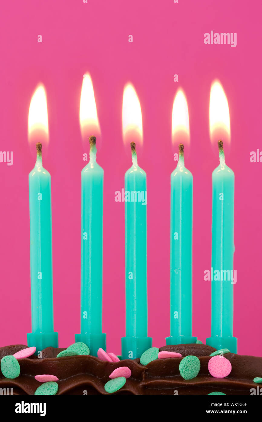 Five birthday candles on a chocolate cake Stock Photo - Alamy