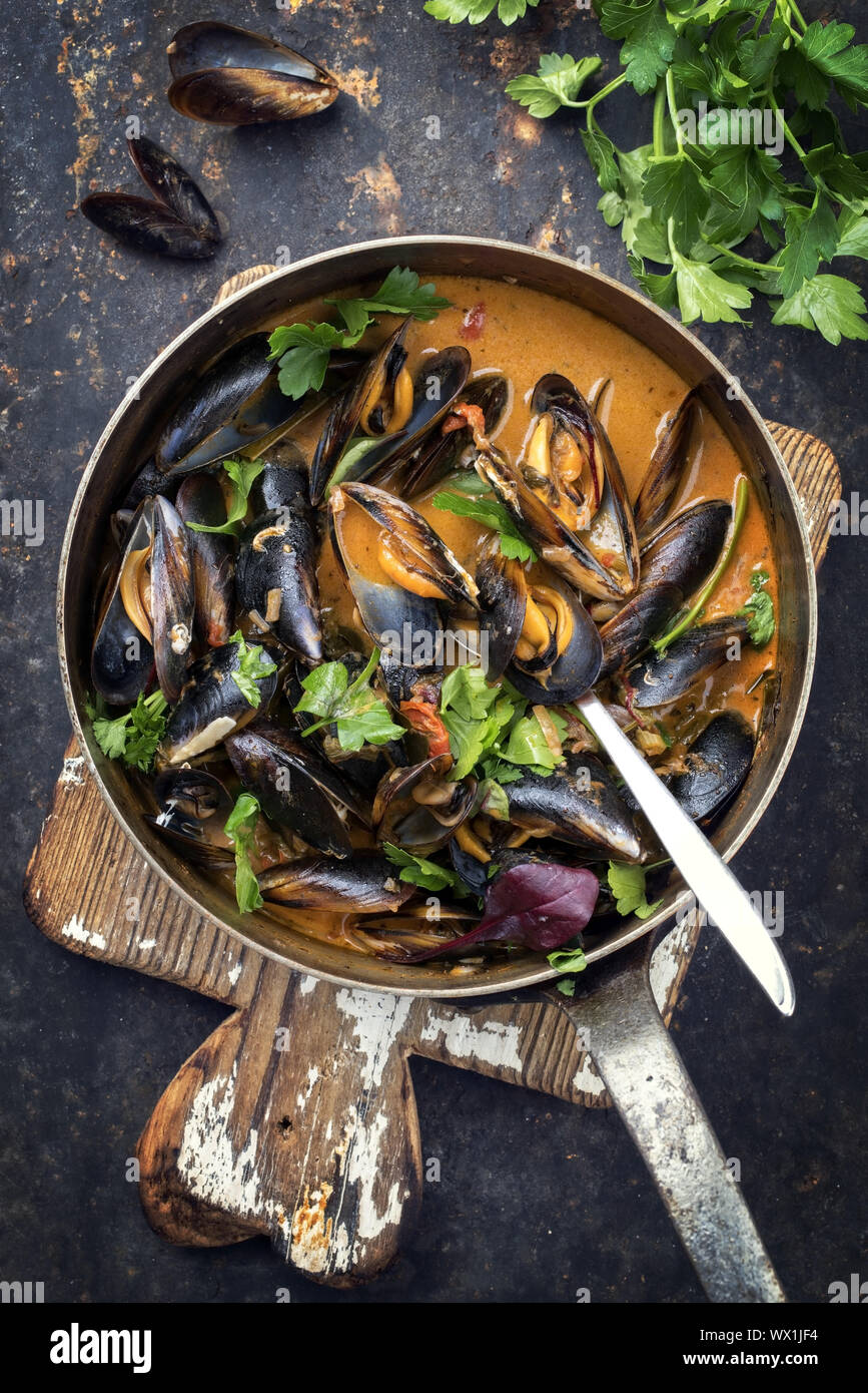Traditional French blue mussel in bouillabaisse as top view in a casserole Stock Photo