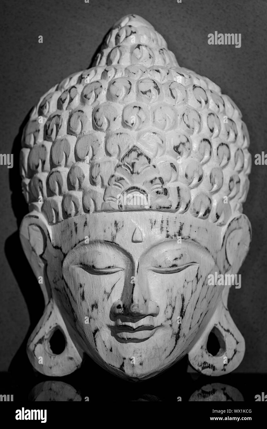 White thai Buddha mask made of wood Stock Photo