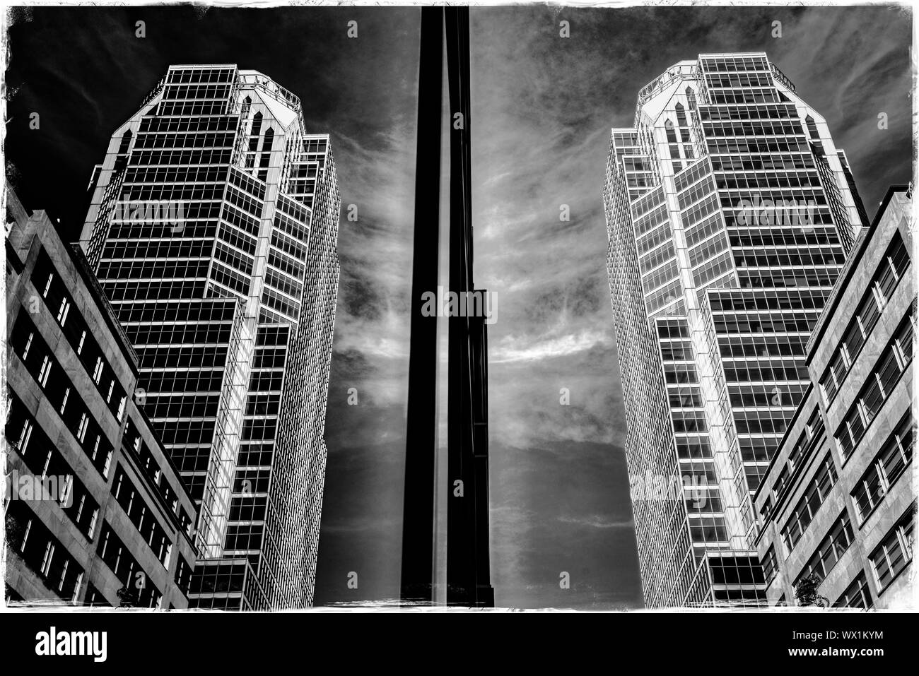 The KPMG Building reflected in the glass walls of the BNP Paribas Building, boulevard Maisonneuve, Montreal Stock Photo