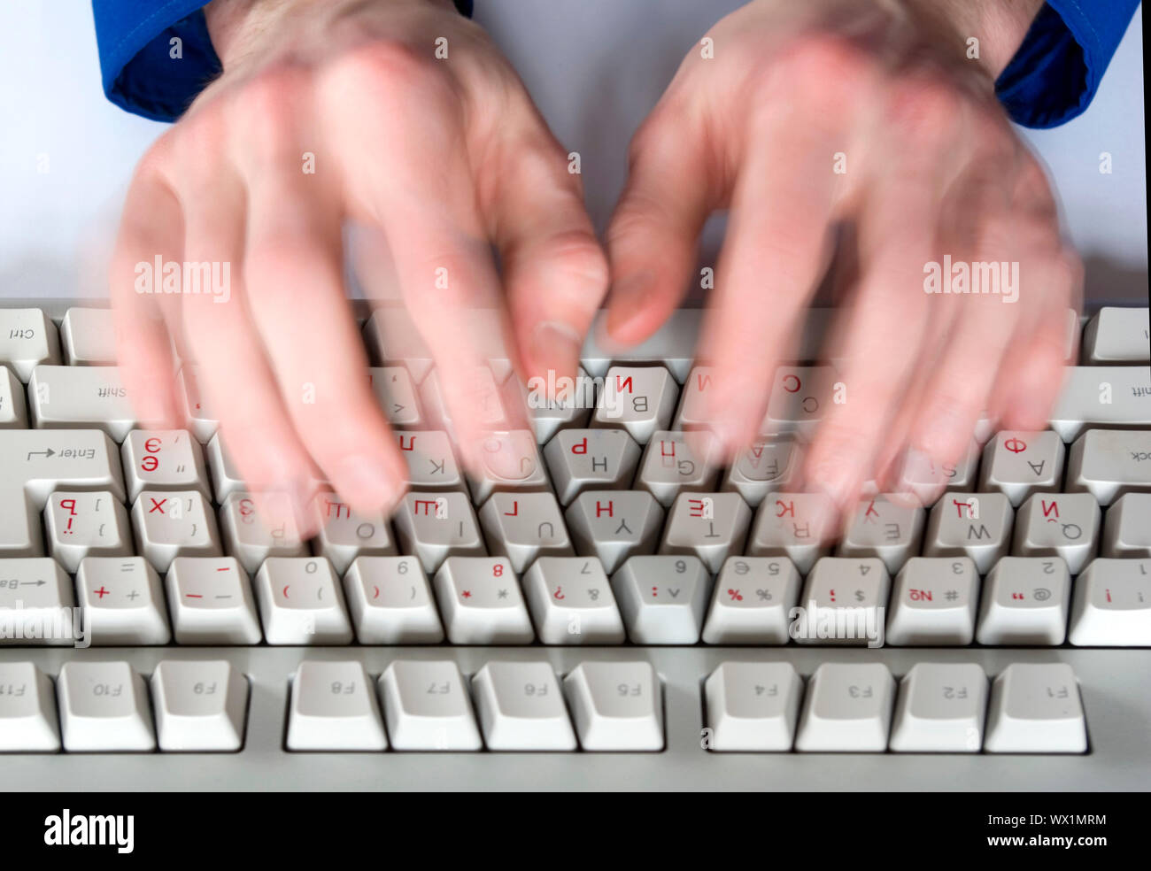 Fingers type a text on the computer keyboard Stock Photo