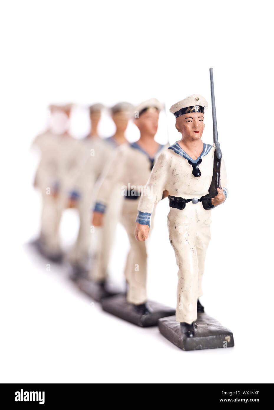 Marching Toy Soldiers Isolated on White Background Stock Photo