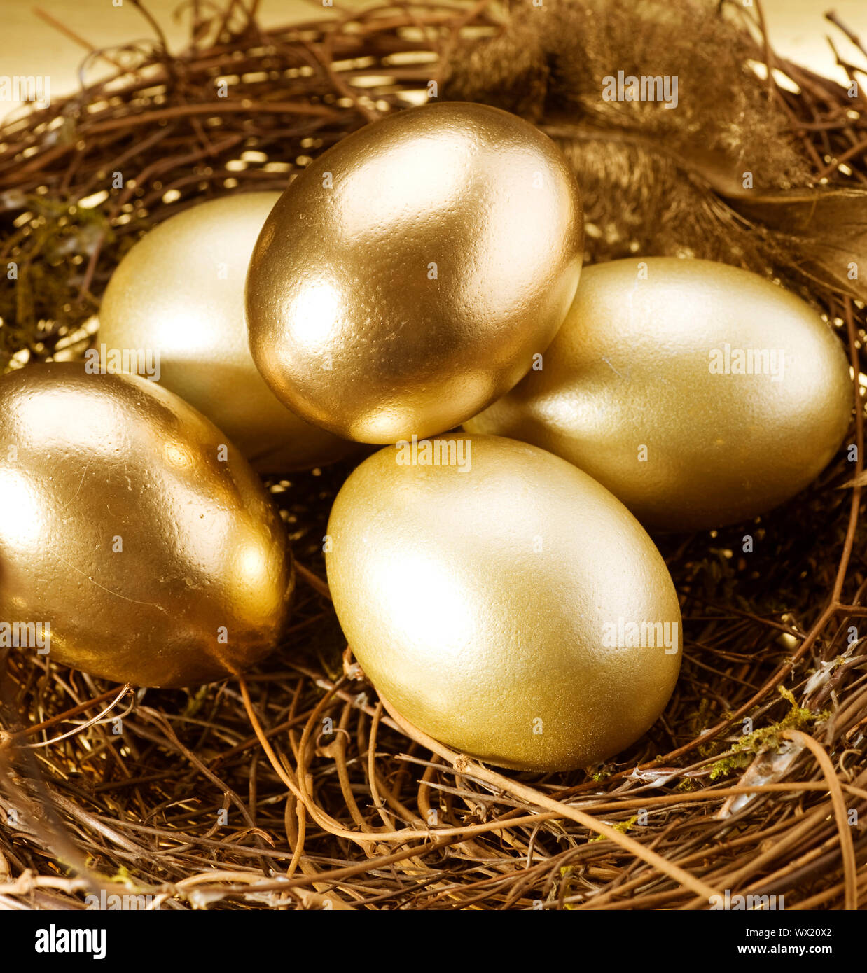 Easter Golden Eggs In A Nest Stock Photo Alamy