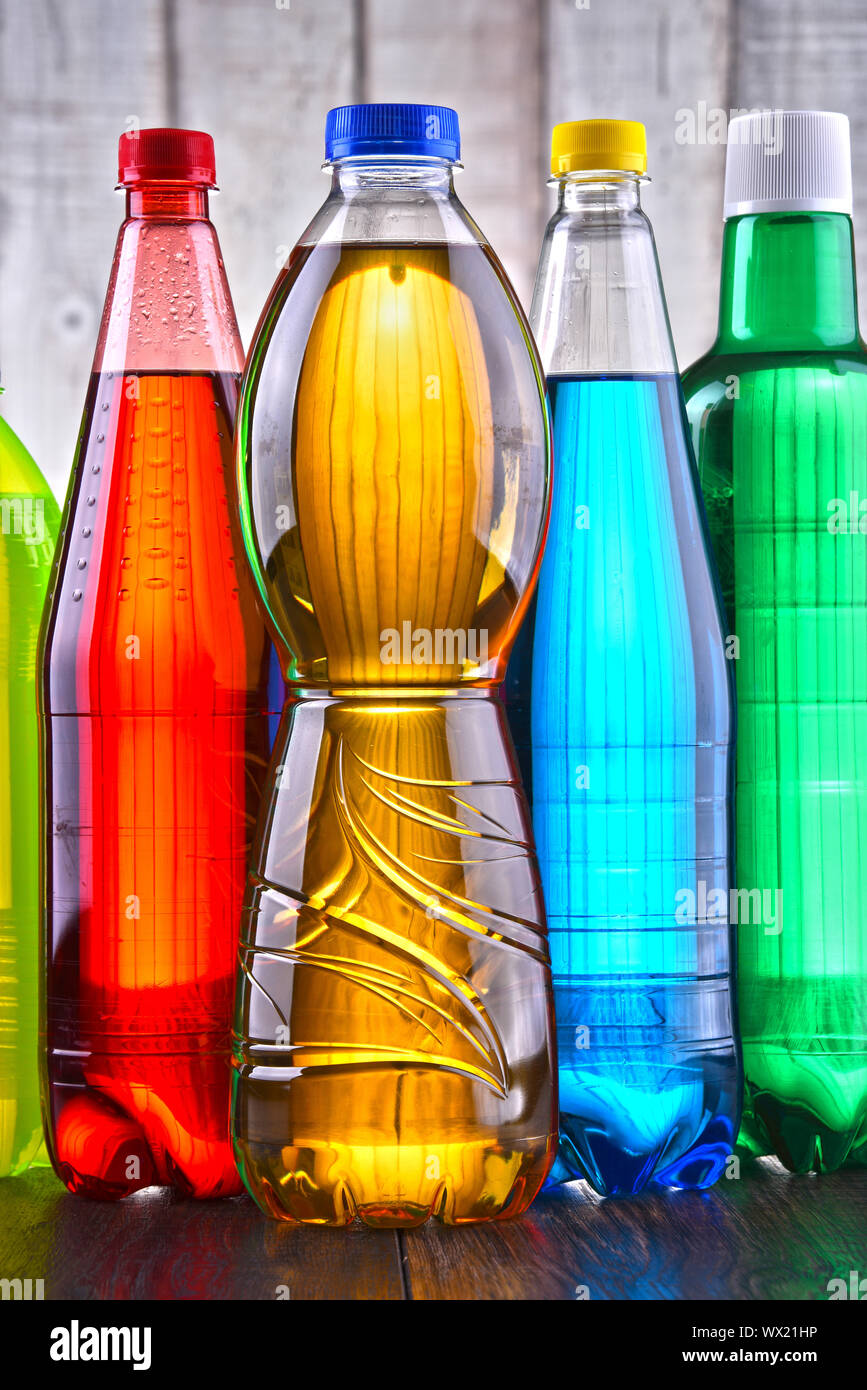Plastic bottles of assorted carbonated soft drinks in variety of colors. Stock Photo