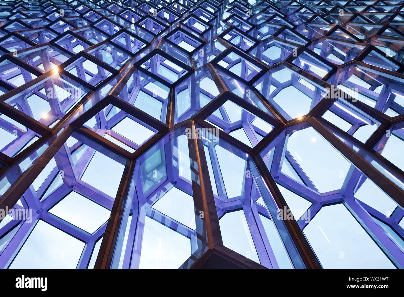Illuminated facade detail of the honeycomb structure, concert hall Harpa, Reykjavik, Iceland, Europe Stock Photo