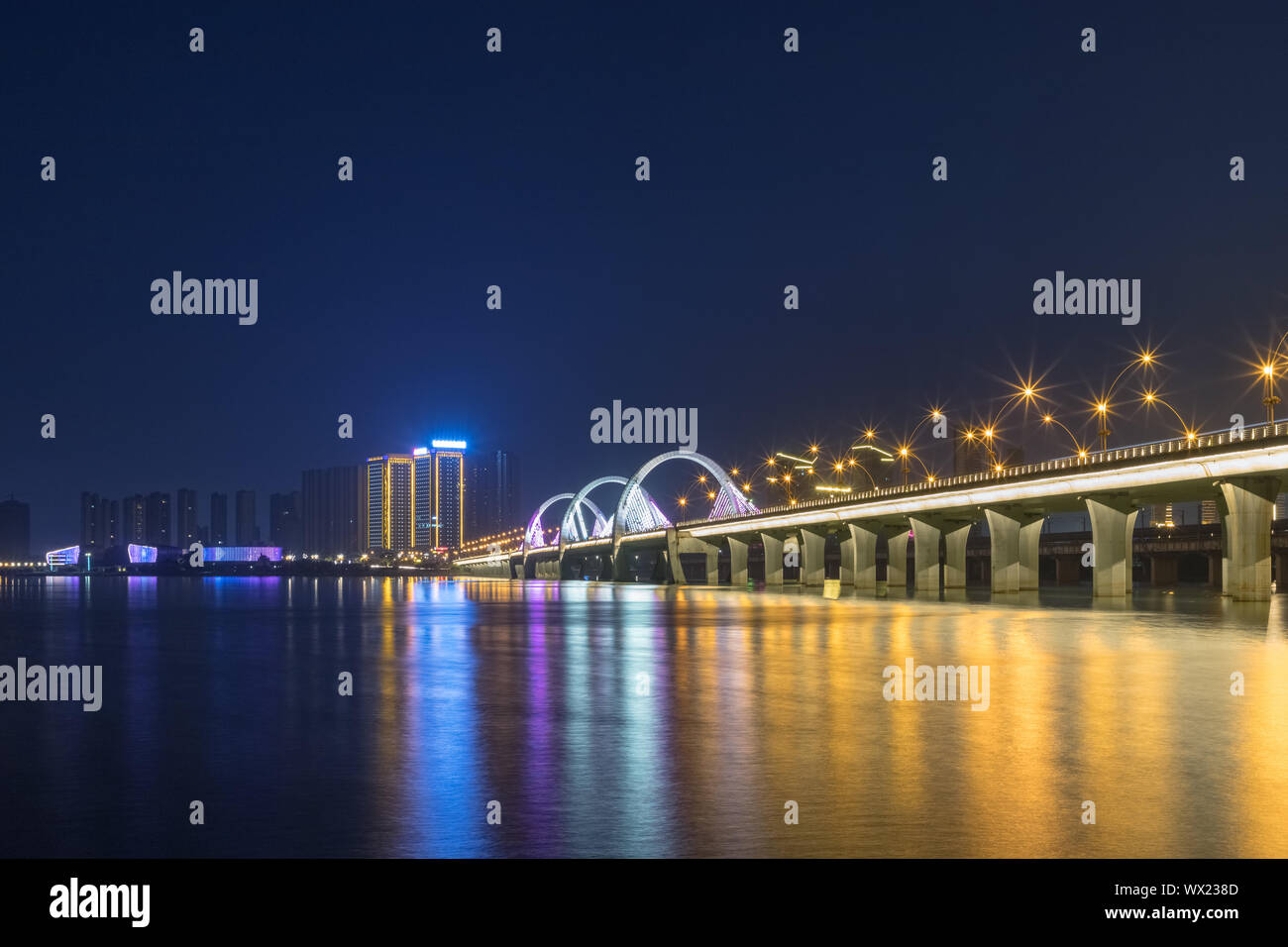 lake and bridge at night in jiujang Stock Photo