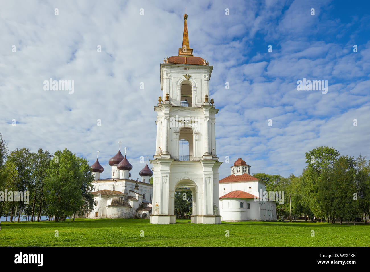 Old bell tower on the background of two Orthodox churches. Cathedral Square in the city of Kargopol. Arkhangelsk region, Russia Stock Photo