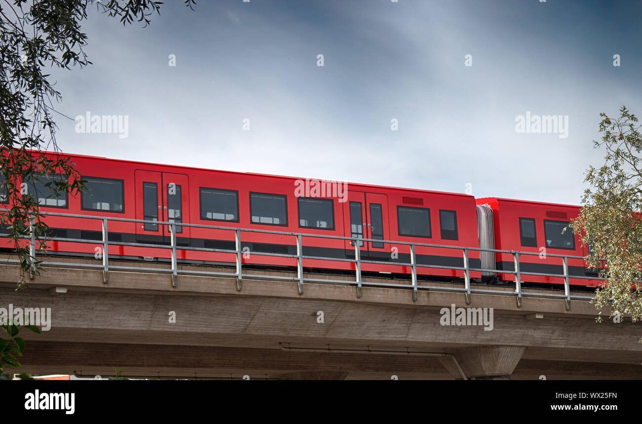 Metro train moves along rack in overhead position Stock Photo Alamy