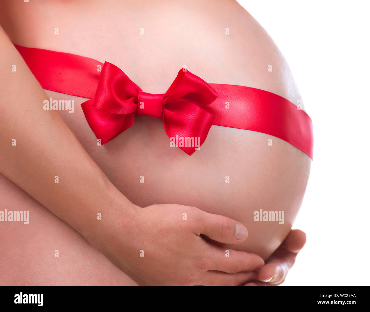 Pregnant Belly with Gift Bow. Pregnancy Stock Photo