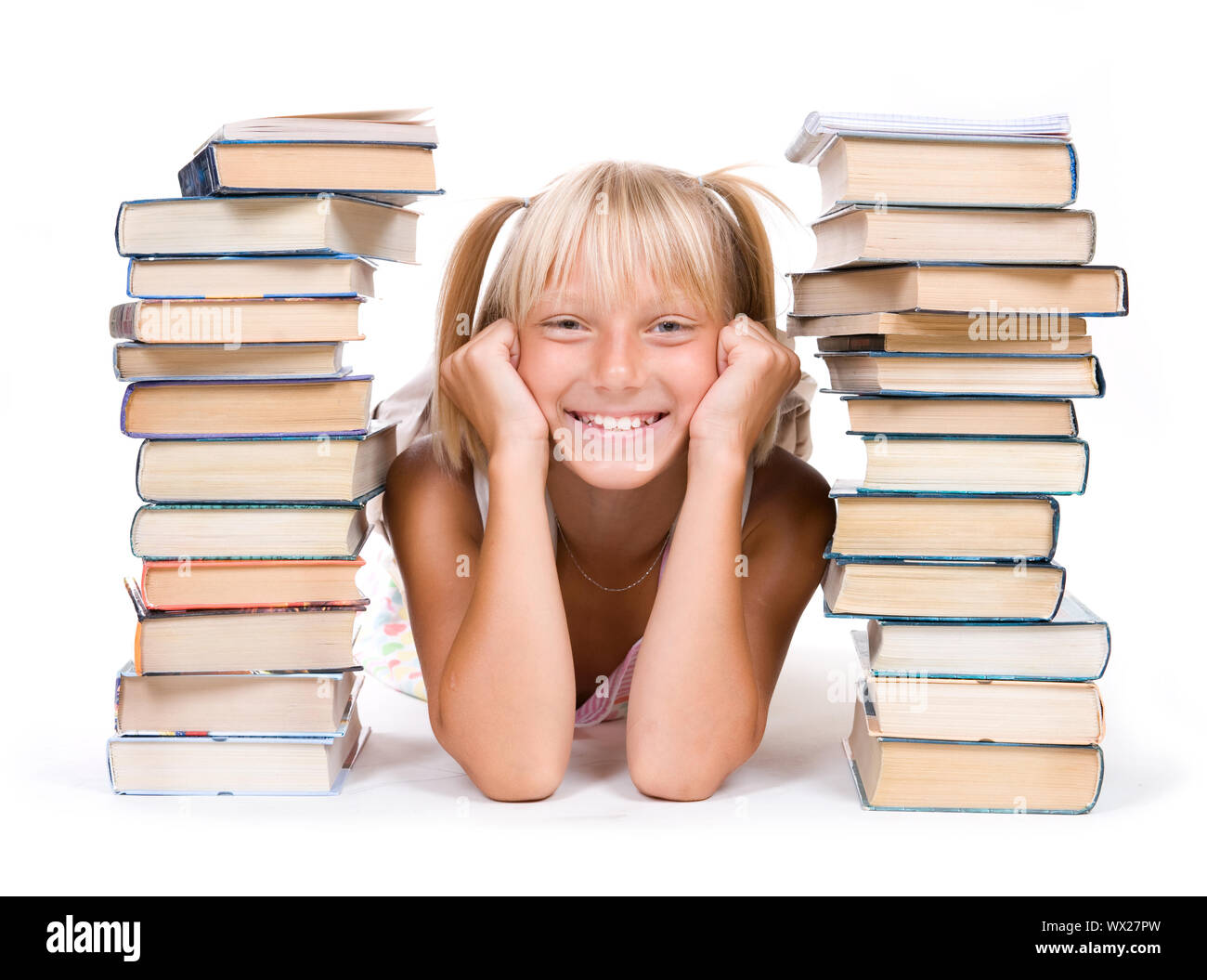 Back To School Concept. School Girl Between The Stacks Of Books Stock ...