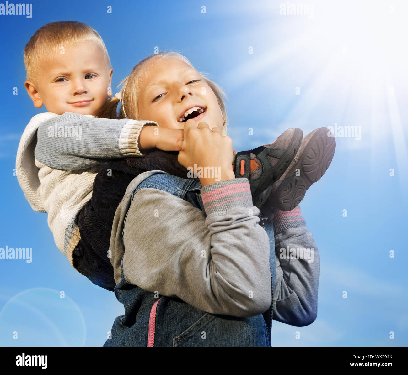 Happy Kids. Sister and Brother Having Fun Outdoor Stock Photo - Alamy