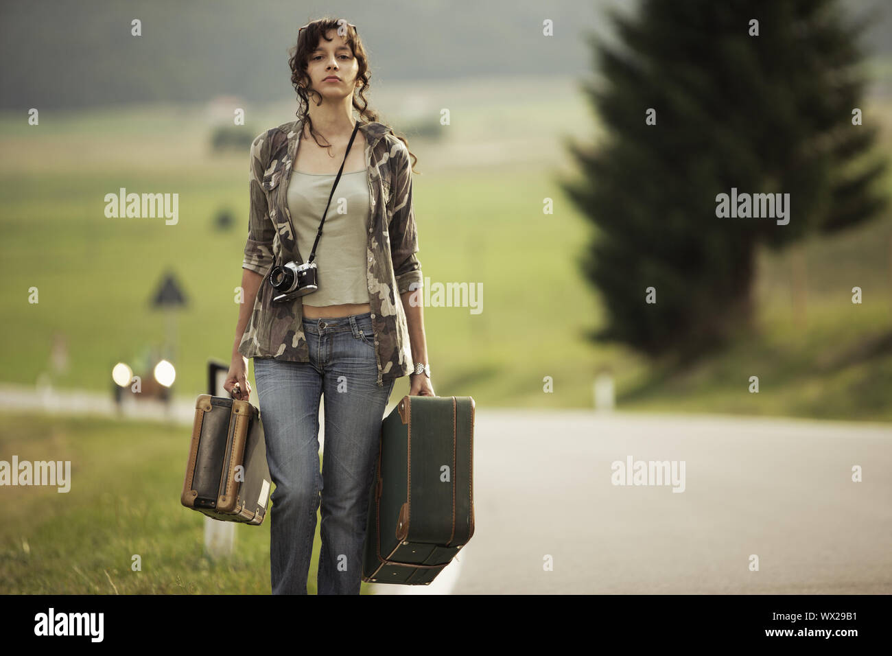 Woman walks suitcase young hi-res stock photography and images - Alamy