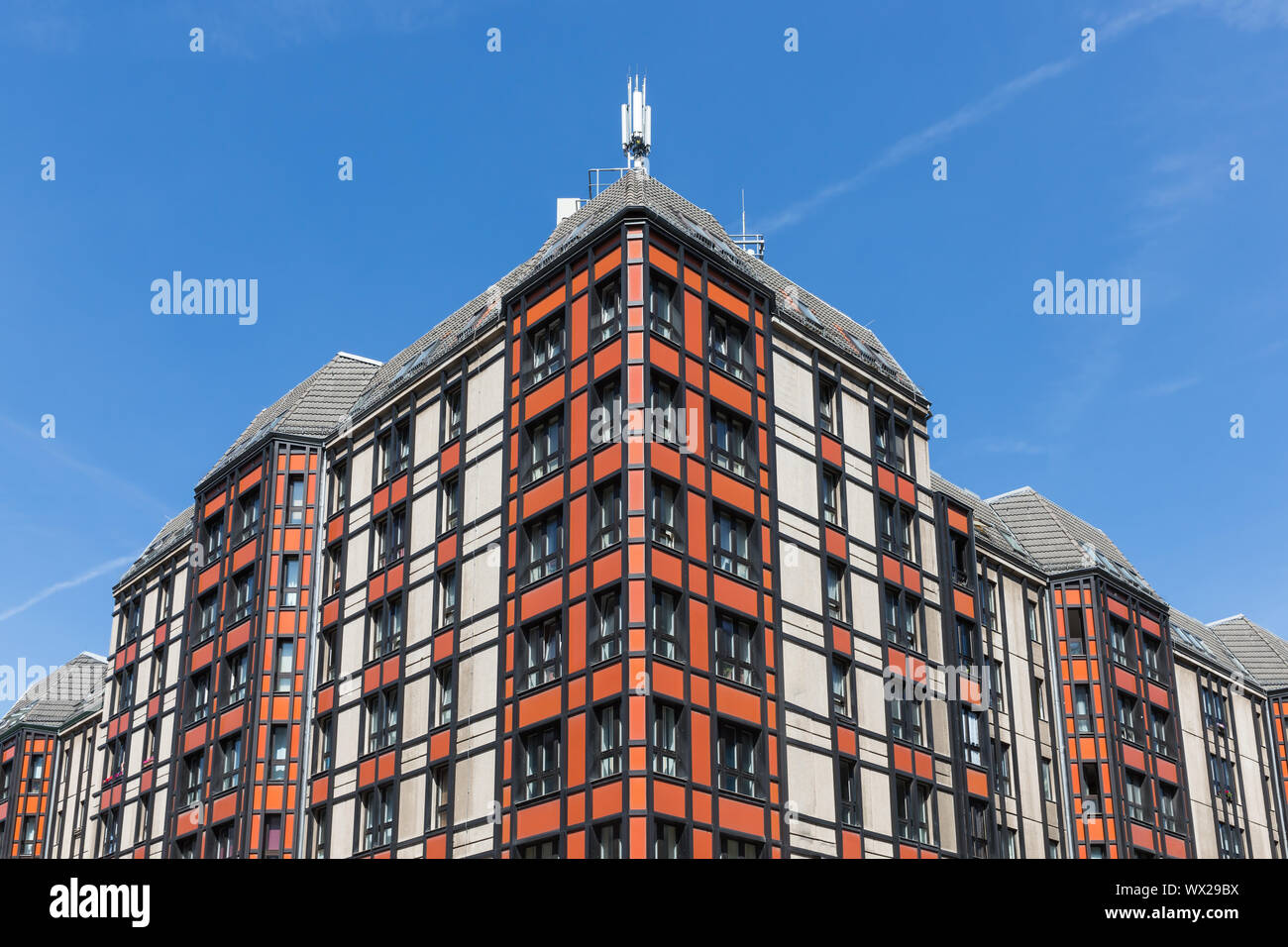 Modern office building in Berlin with facade of red and white Stock Photo