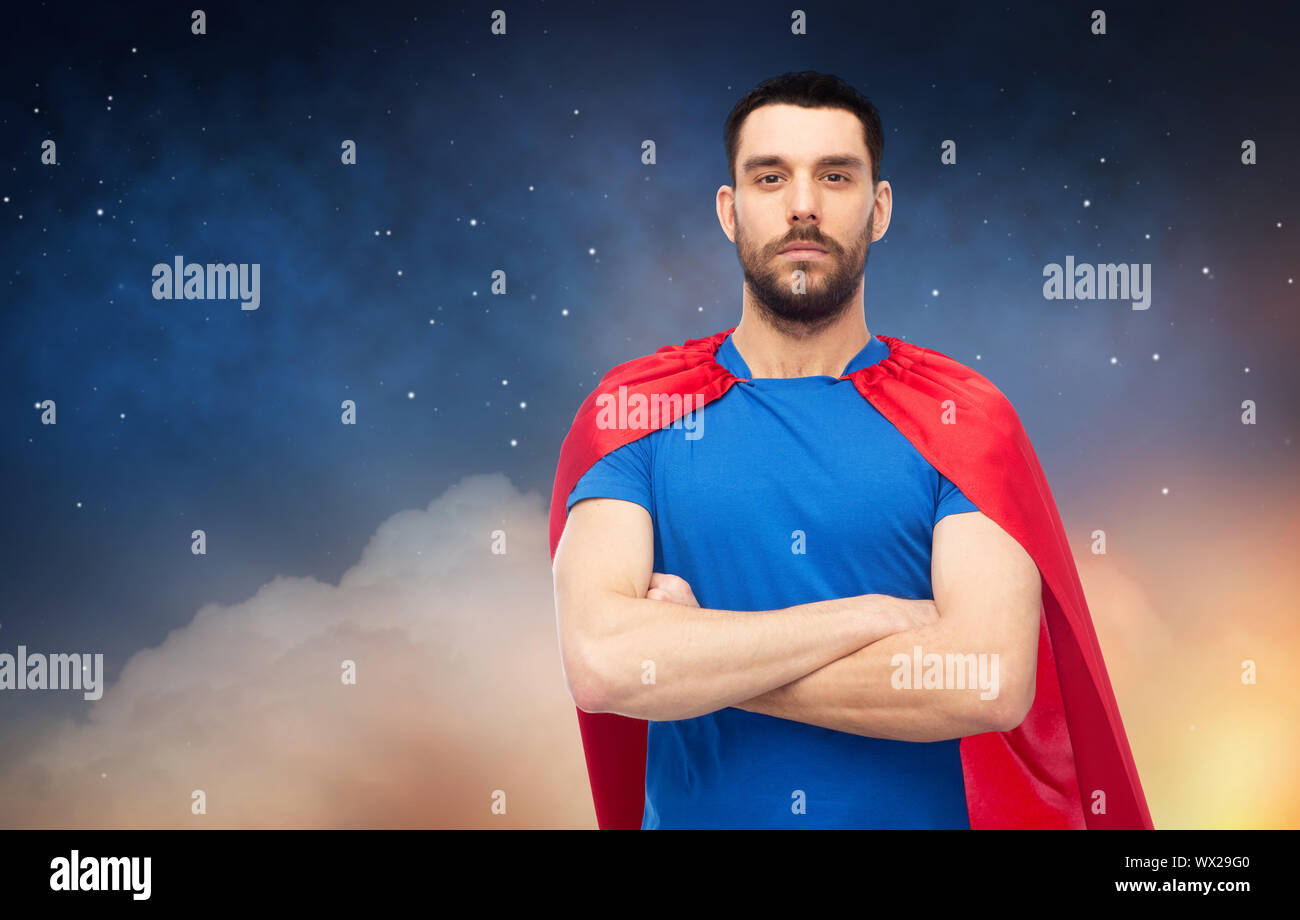 man in red superhero cape over night sky Stock Photo - Alamy