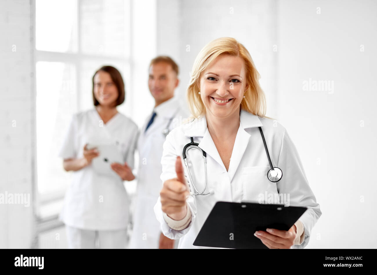 Thumbs up smiling confident doctor hi-res stock photography and images ...