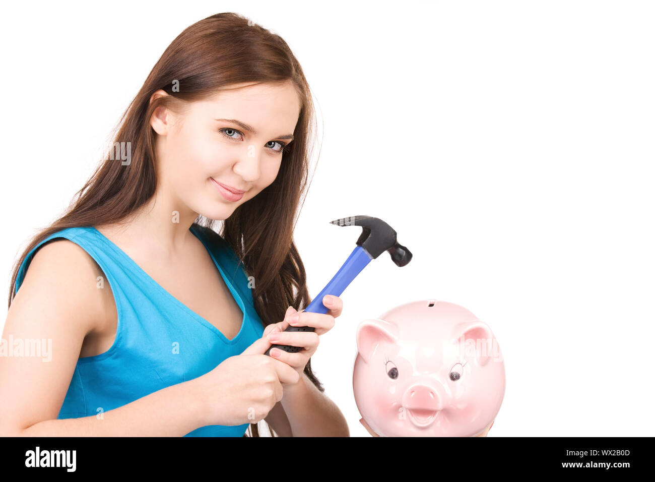 lovely teenage girl with piggy bank and hammer Stock Photo - Alamy