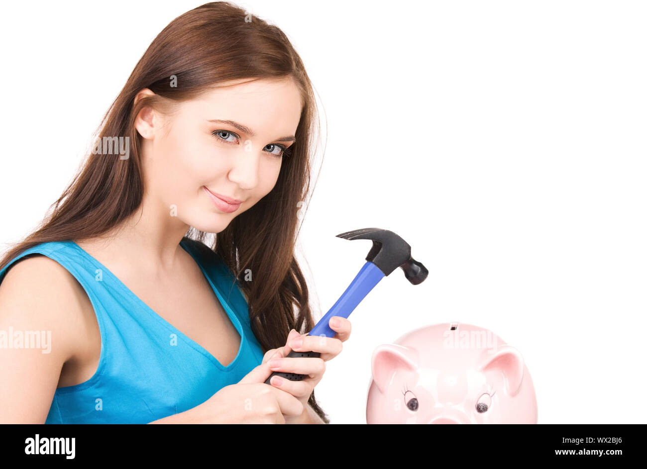 teenage girl with piggy bank and hammer Stock Photo - Alamy