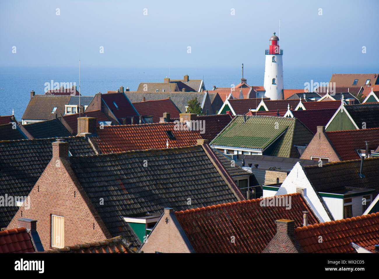 View at the lighthouse and roofs of an old fishing village in the
