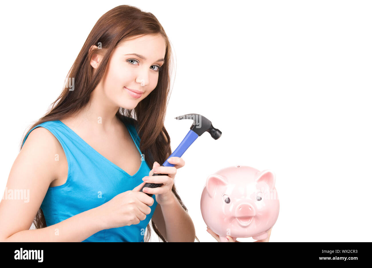 lovely teenage girl with piggy bank and hammer Stock Photo - Alamy