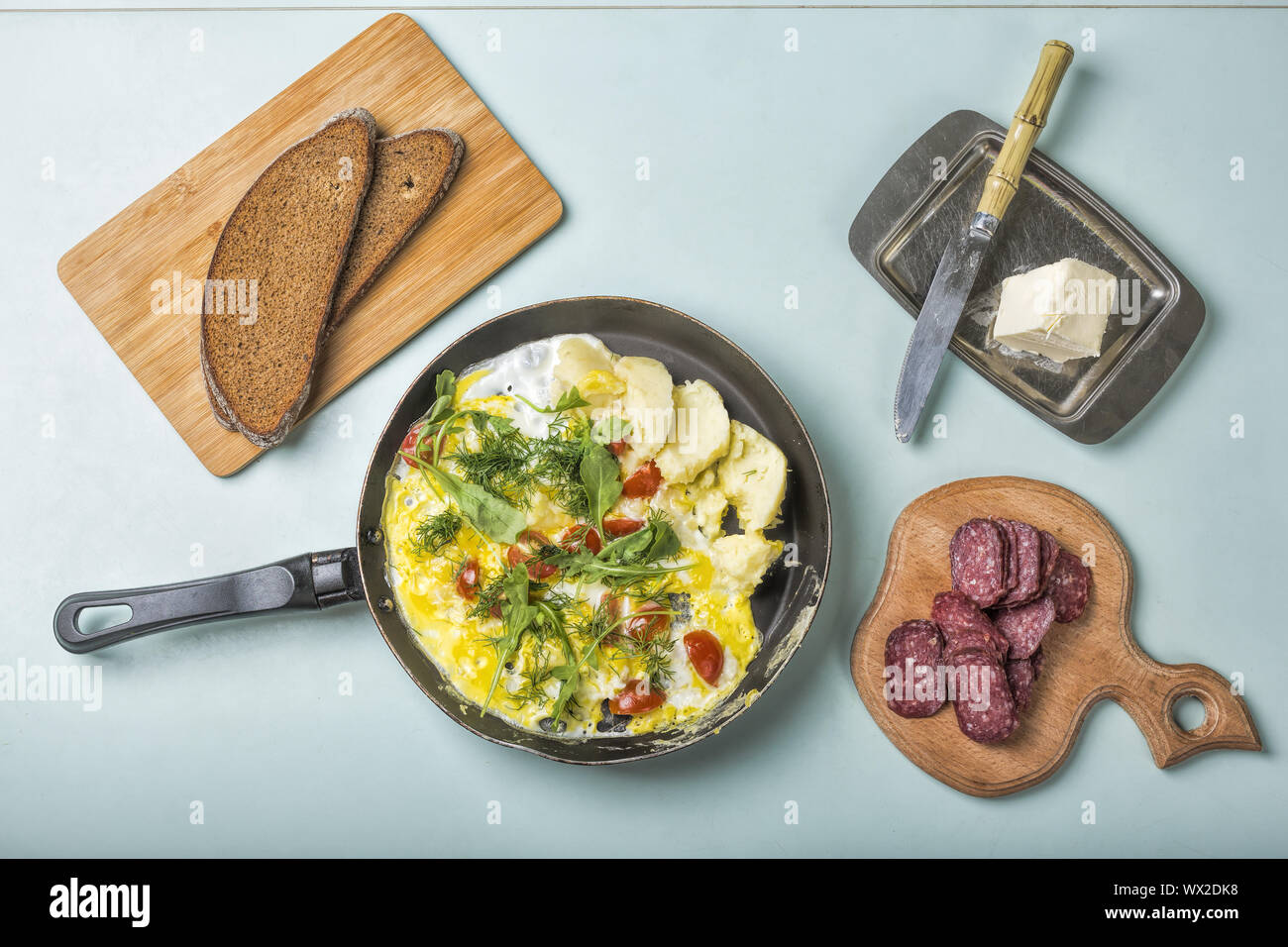 omelette, breakfast, omelette, top view, vegetables, salami, coarse bread Stock Photo